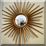 DM01. Sunburst mirror with gold tone frame. 